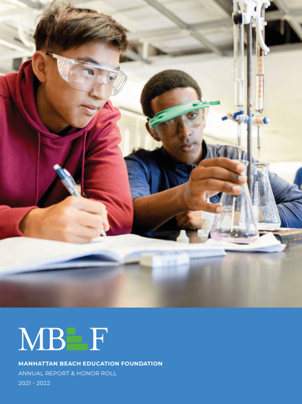 Two students conducting a chemistry experiment in a lab.