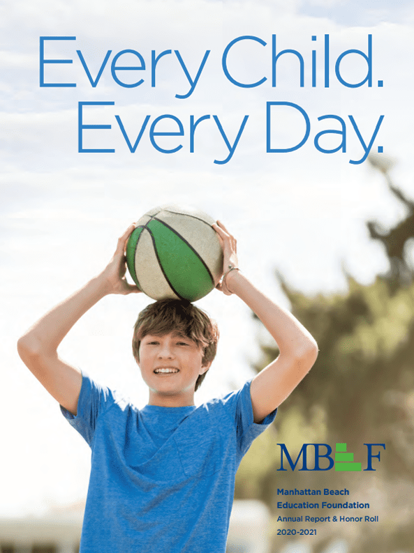 Smiling boy holding a basketball outdoors on a sunny day.